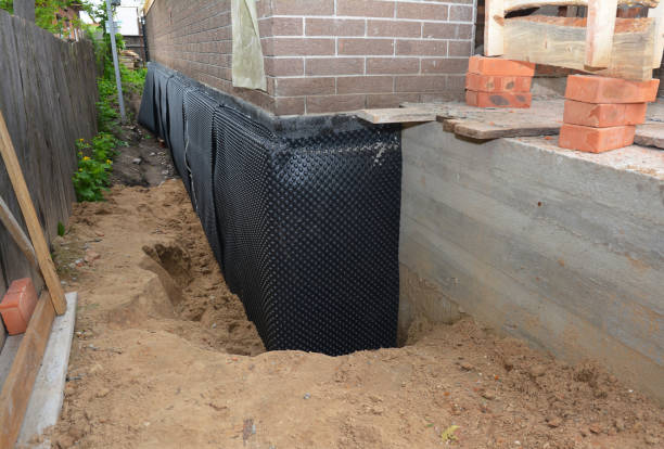 Happy homeowners after waterproofing job in Centereach